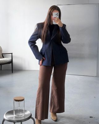 A jacket and jeans that speak your style before you even say a word. The deep blue jacket with a strong shoulder line...